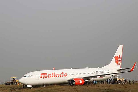 Officials check an aircraft belonging to Malindo Air at Nepal airport