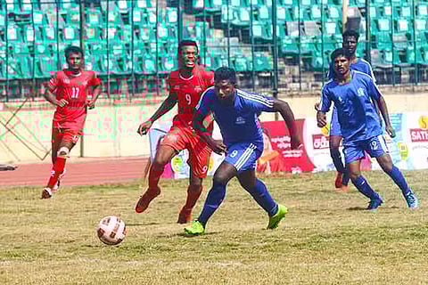 ICF?s Jayakumar (2nd from right) vies for the ball with Viva Chennai?s Eze Daniel in the CFA League