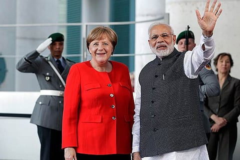 German Chancellor Angela Merkel welcomes India's Prime Minister Narendra Modi
