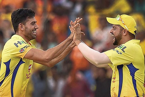 Chennai Super Kings (CSK) bowler Deepak Chahar celebrates a wicket with Suresh Raina