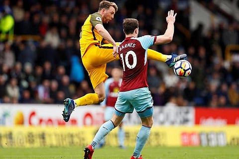 Burnley's Ashley Barnes in action with Brighton's Dale Stephens