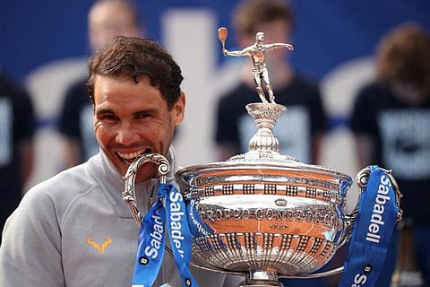 Rafael Nadal celebrates with the trophy after winning the final against Stefanos Tsitsipas