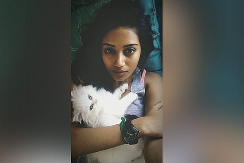 Nivetha with her cat Nandumurugan