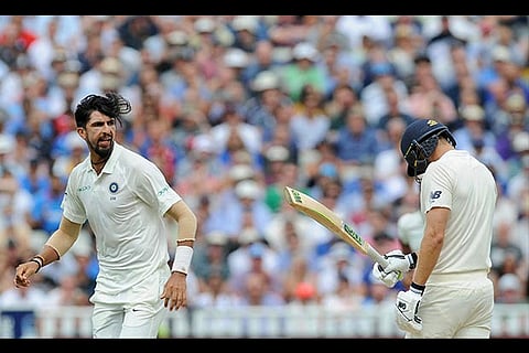 India's Ishant Sharma, left, celebrates after dismissing England's Dawid Malan
