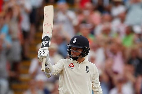 England's Sam Curran celebrates after reaching a half century