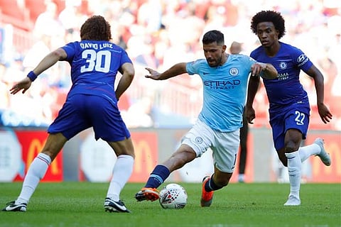 Manchester City's Sergio Aguero in action with Chelsea's David Luiz and Willian