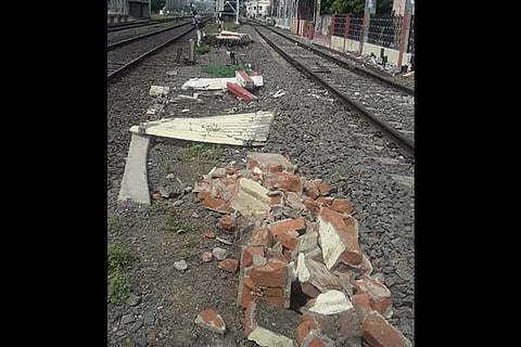 The fence at Pazhavanthangal railway station that was demolished on Monday