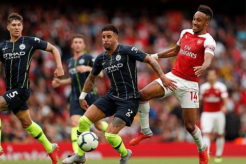 Arsenal's Pierre-Emerick Aubameyang in action with Manchester City?s Kyle Walker