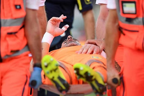 Chievo Verona's Stefano Sorrentino leaves the pitch on a stretcher after sustaining an injury