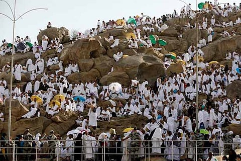 Muslim pilgrim gather on Mount Mercy on the plains of Arafat