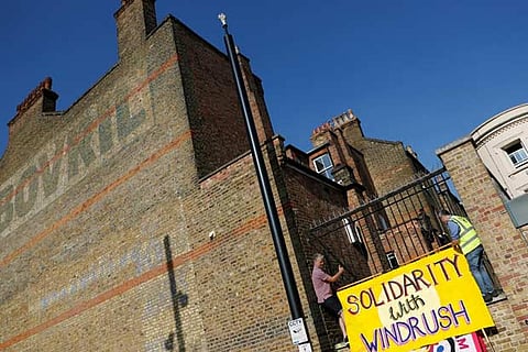 A banner shows solidarity with the Windrush generation in the Brixton district of London, Britain