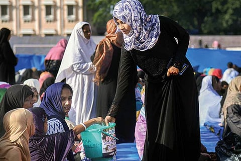 Muslims collect fund for victims of Kerala floods after offering prayers on the occasion of Bakrid