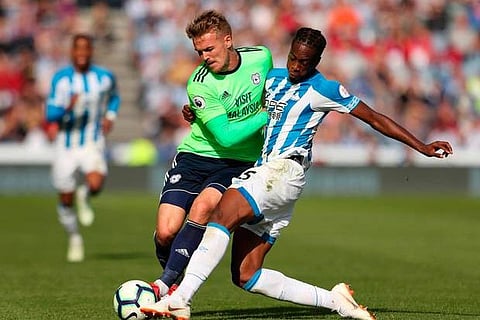 Huddersfield Town's Terence Kongolo in action with Cardiff City's Danny Ward