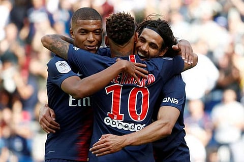 Paris St Germain's Edinson Cavani celebrates scoring their first goal with Neymar and Kylian Mbappe