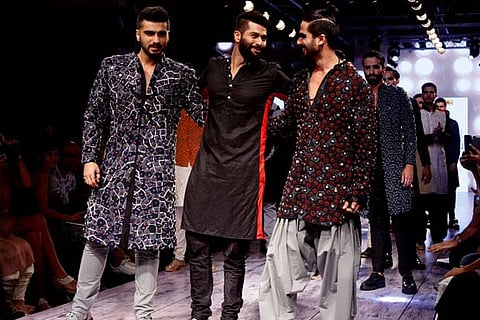 Fashion Designer Kunal Rawal (C) with Arjun Kapoor (L) and Shahid Kapoor (R)