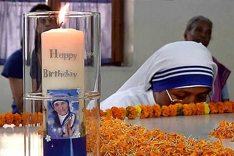 Nuns offer prayers during the 108th birth anniversary celebration of Mother Teresa