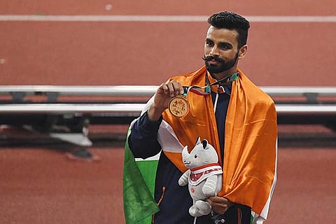 Arpinder Singh at the medal ceremony during the 18th Asian Games