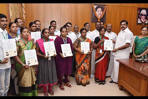 File photo of CM Edapaddi K Palaniswami handing over appointment orders to the kin of Ockhi victims