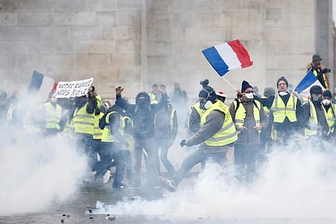 French police clash with "yellow vest" protesters in Paris, 129 arrested