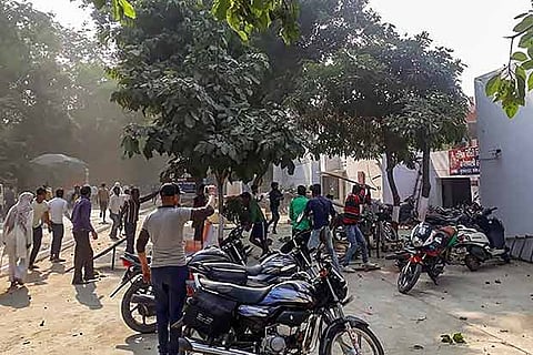 A mob protests over the alleged illegal slaughter of cattle in Bulandshahr