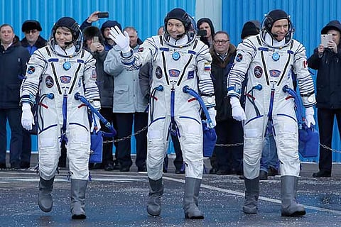 (From L) NASA astronaut Anne McClain, Russian cosmonaut Oleg Kononenko, Canada?s David Saint-Jacques