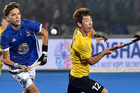China's Dihao Meng and France's Timothee Clement vie for the ball during their match