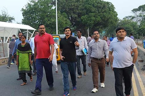 Corporation Commissioner D Karthikeyan with other officials at Marina on Tuesday morning