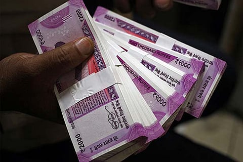 Rupee strengthens 50 paise to 69.94 against US dollar