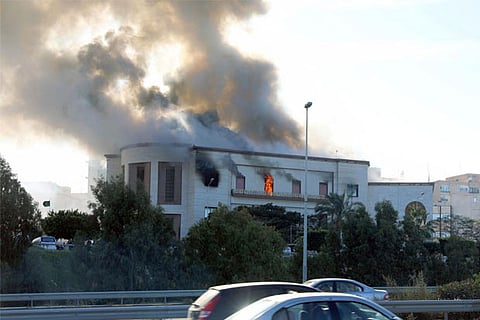 Smoke rises from the site of the headquarters of Libya's foreign ministry after suicide attack