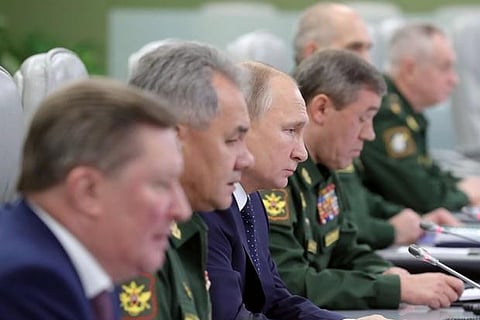 Russia's President Vladimir Putin (3rd L) visits the National Defence Control Centre