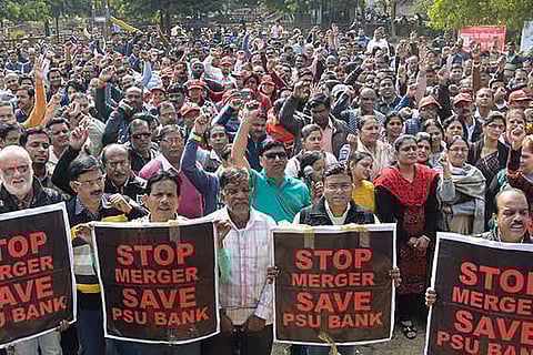 Bank employees stage a protest against the proposed merger in Jabalpur