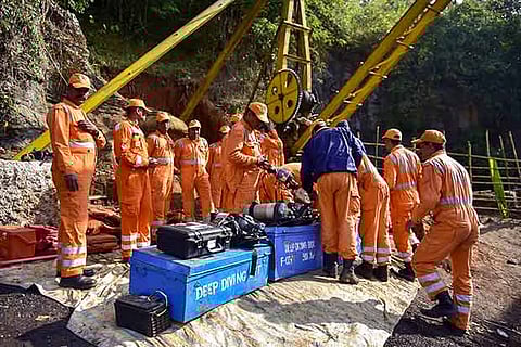 NDRF personnel conduct a rescue task at the site of a coal mine collapse