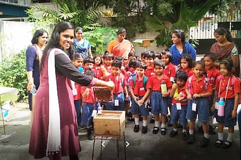 L Usha taking bee harvesting classes for students in the city
