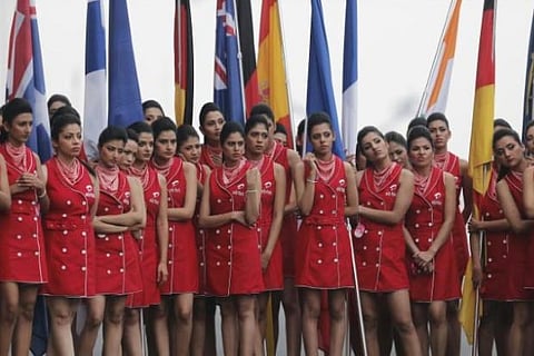 Pit girls rehearse on the eve of the Indian F1 Grand Prix at the Buddh Circuit.(Photo: Reuters)