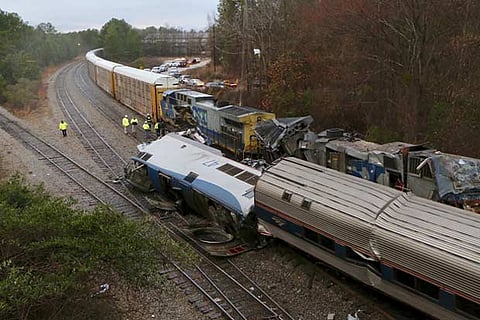 Authorities investigate the scene of a fatal Amtrak train crash in Cayce, South Carolina