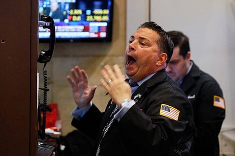 A trader reacts on the floor of the New York Stock Exchange in New York