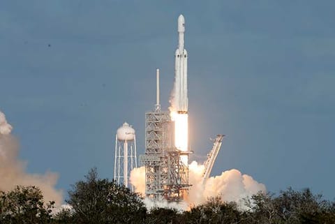 A SpaceX Falcon Heavy rocket lifts off Kennedy Space Center in Cape Canaveral, Florida
