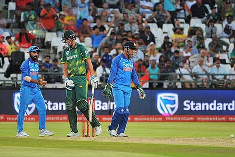Chris Morris (centre) walks off after being dismissed