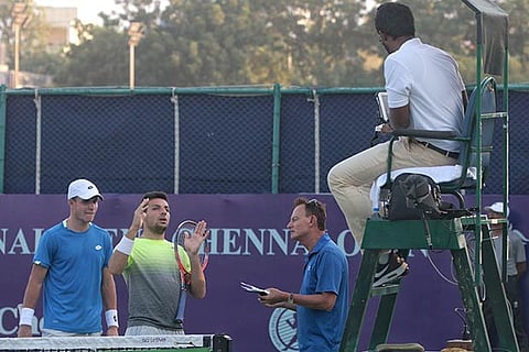 Doubles pair of Dmitry Popko (l) and Bernabe Zapata Miralles argue with an official (Photo: Justin)