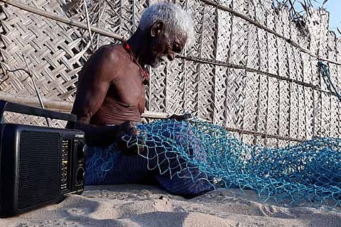 Fisherman Chandra Bose (75), fondly called ?Radio Thatha?, readying fishing nets