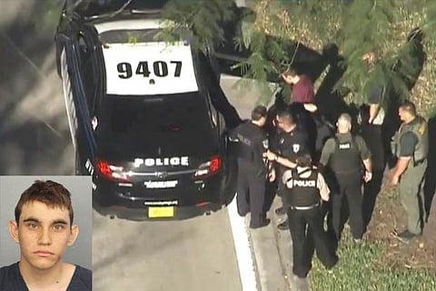 Nikolas Cruz in a police booking photo after being charged with 17 counts of premeditated murder