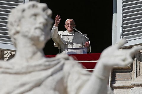 Pope Francis leads the Angelus prayer in Saint Peter's Square at the Vatican