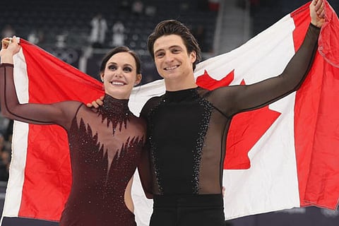 Gold medallists Tessa Virtue and Scott Moir of Canada celebrate