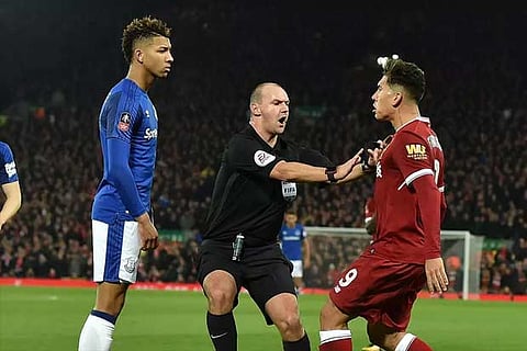 File photo of Firmino and Holgate clash in the FA Cup