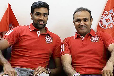 Ravichandran Ashwin with Kings XI Punjab coach Virender Sehwag
