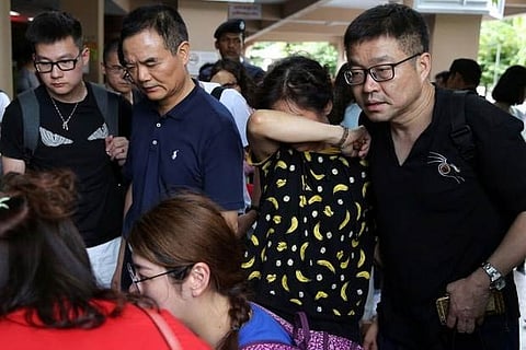 Relatives of Chinese tourists involved in a sunken tourist boat accident are seen at a hospital