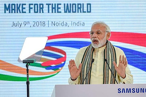 PM Narendra Modi addresses at the inauguration ceremony of Samsung mobile factory, in Noida
