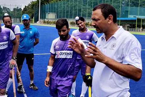 Indian men's hockey coach Harendra Singh with the team