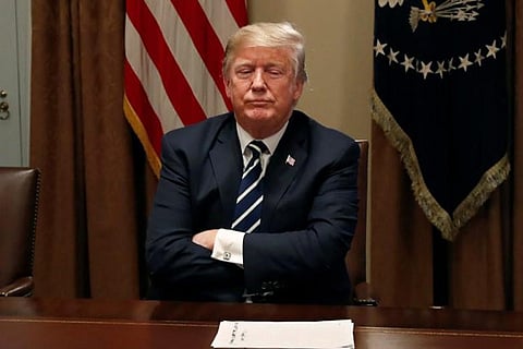 US President Trump waits for reporters to leave the room after speaking about the Helsinki summit