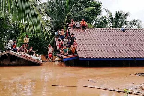 Villagers evacuate after the Xerpian-Xe Nam Noy hydropower dam collapsed in Laos